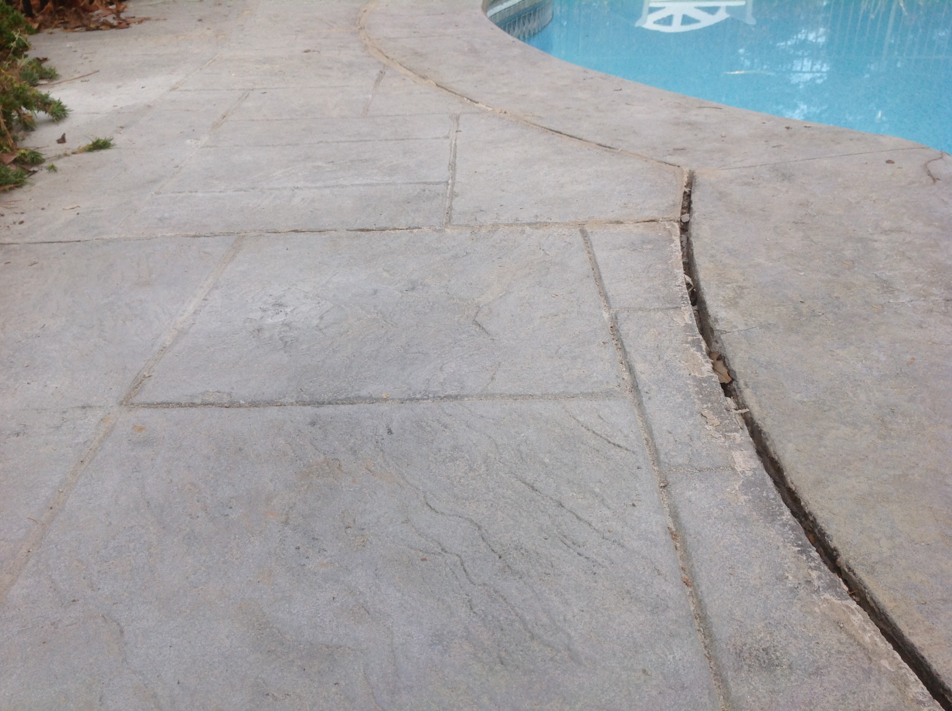 Unlevel concrete cracked pool deck
