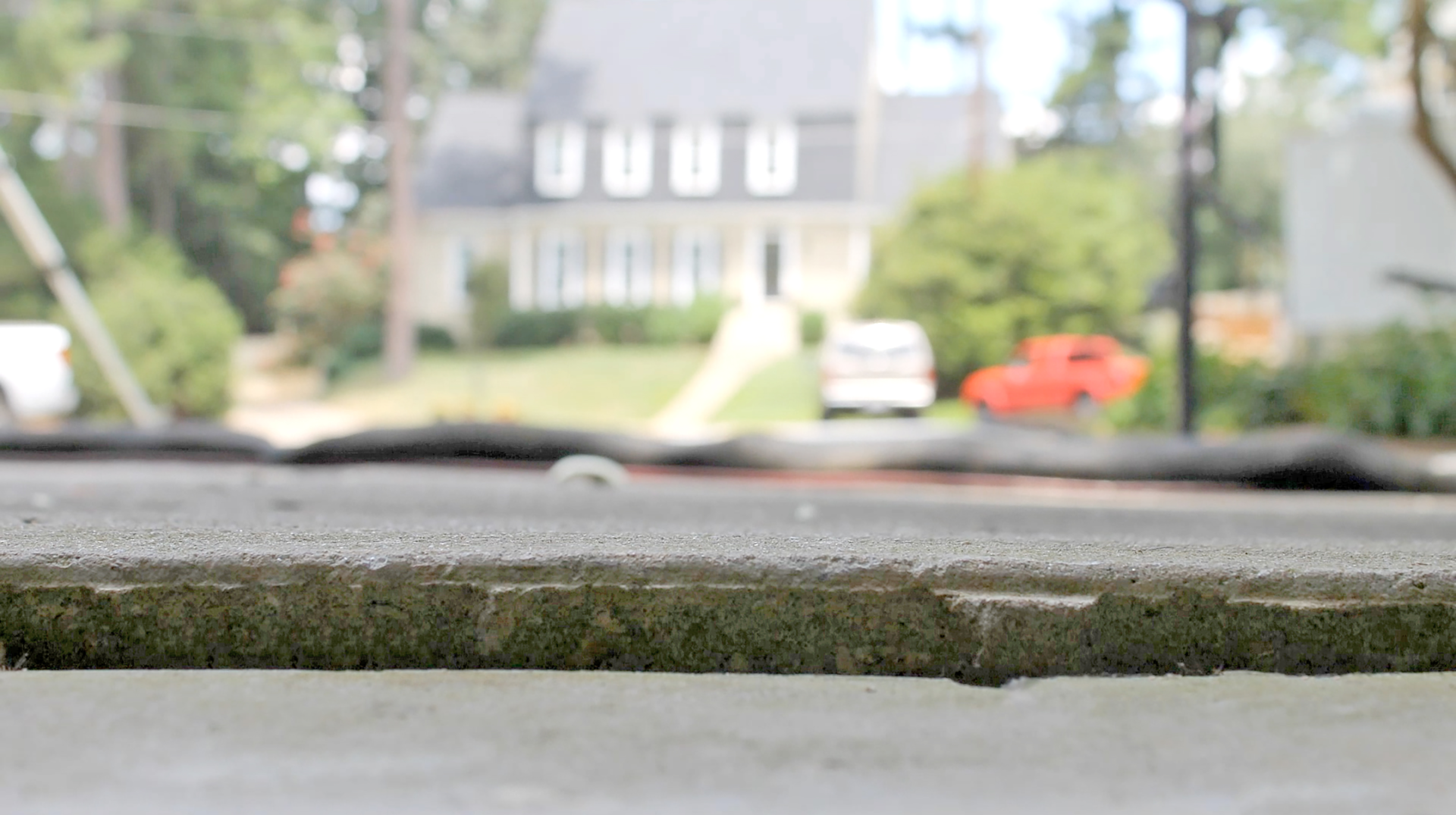 Concrete outside of sinking garage - before